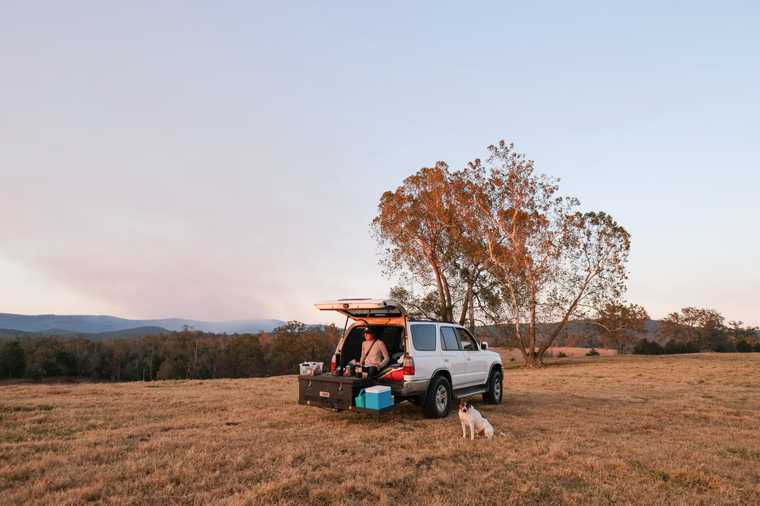 Drinking coffee out of truck in field
